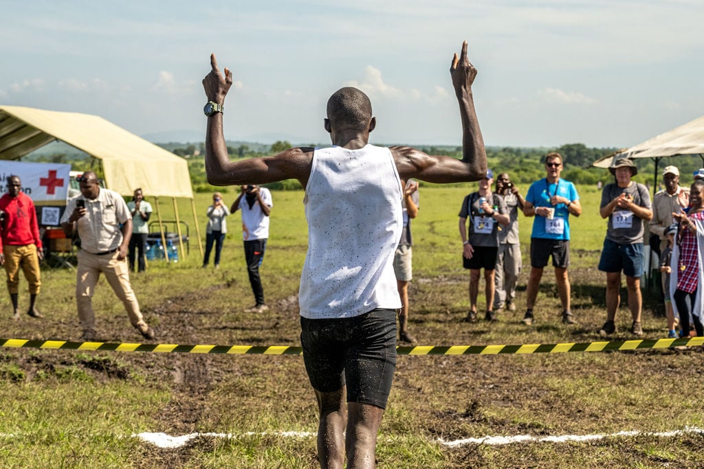 Elkana crosses the line in first place for the men's 50km relay 