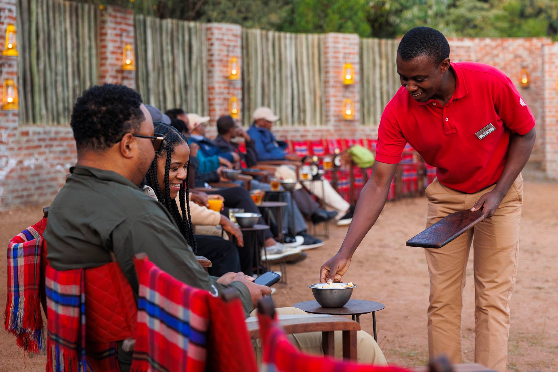Above: Firelight, refills, smiles — comfort, served