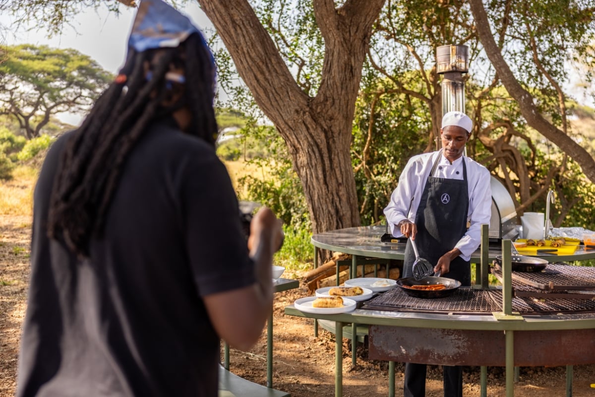 Filming with a shallow depth of field, Bryan tracks Chef Tiya