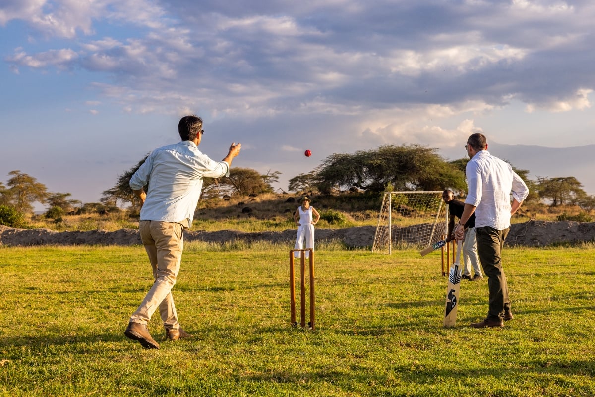 Editor, Timothy from the Angama Academy plays a good game of cricket with Amboseli guests