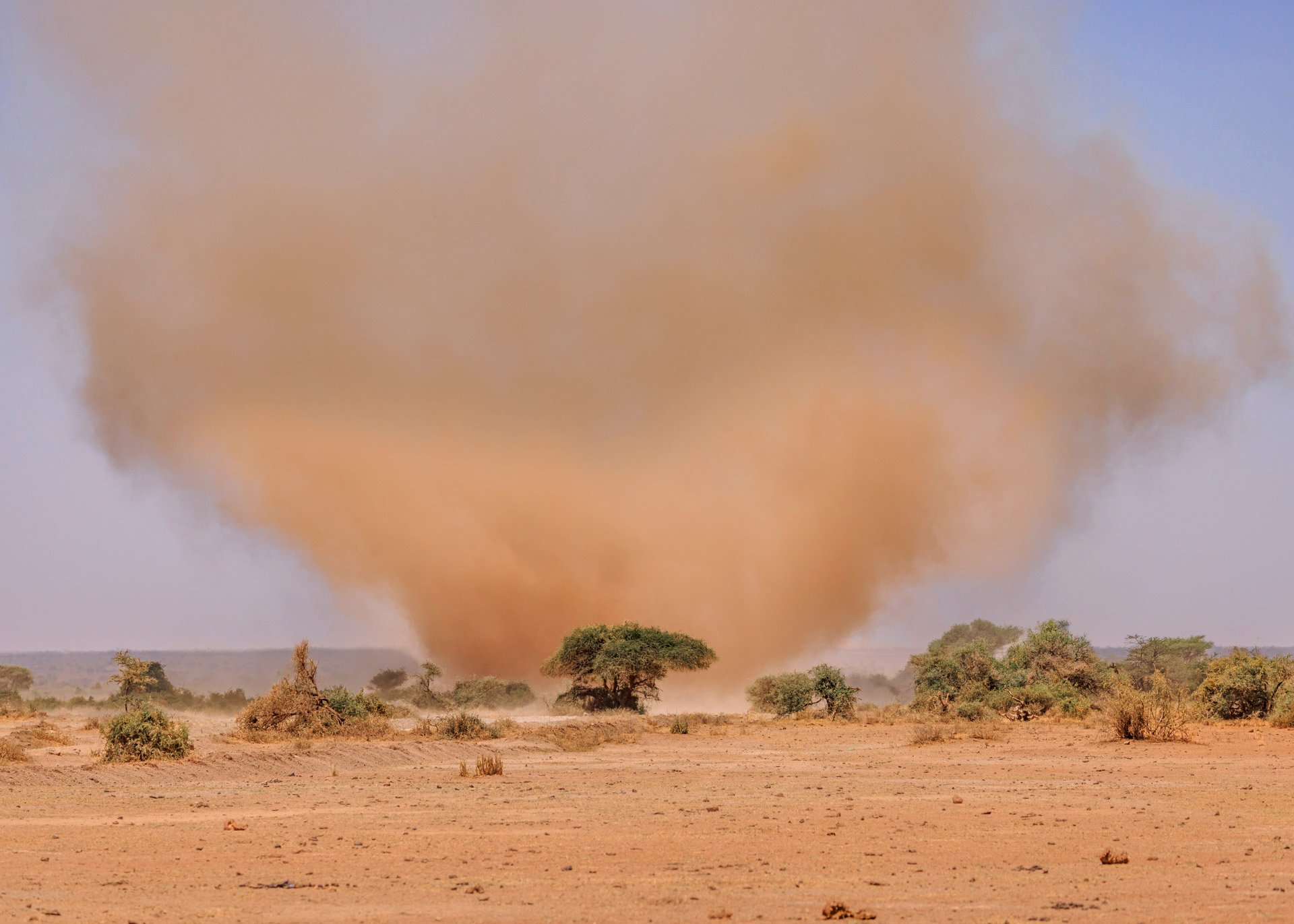 Dust is part of Amboseli life — each guest receives a buff for comfort on drives