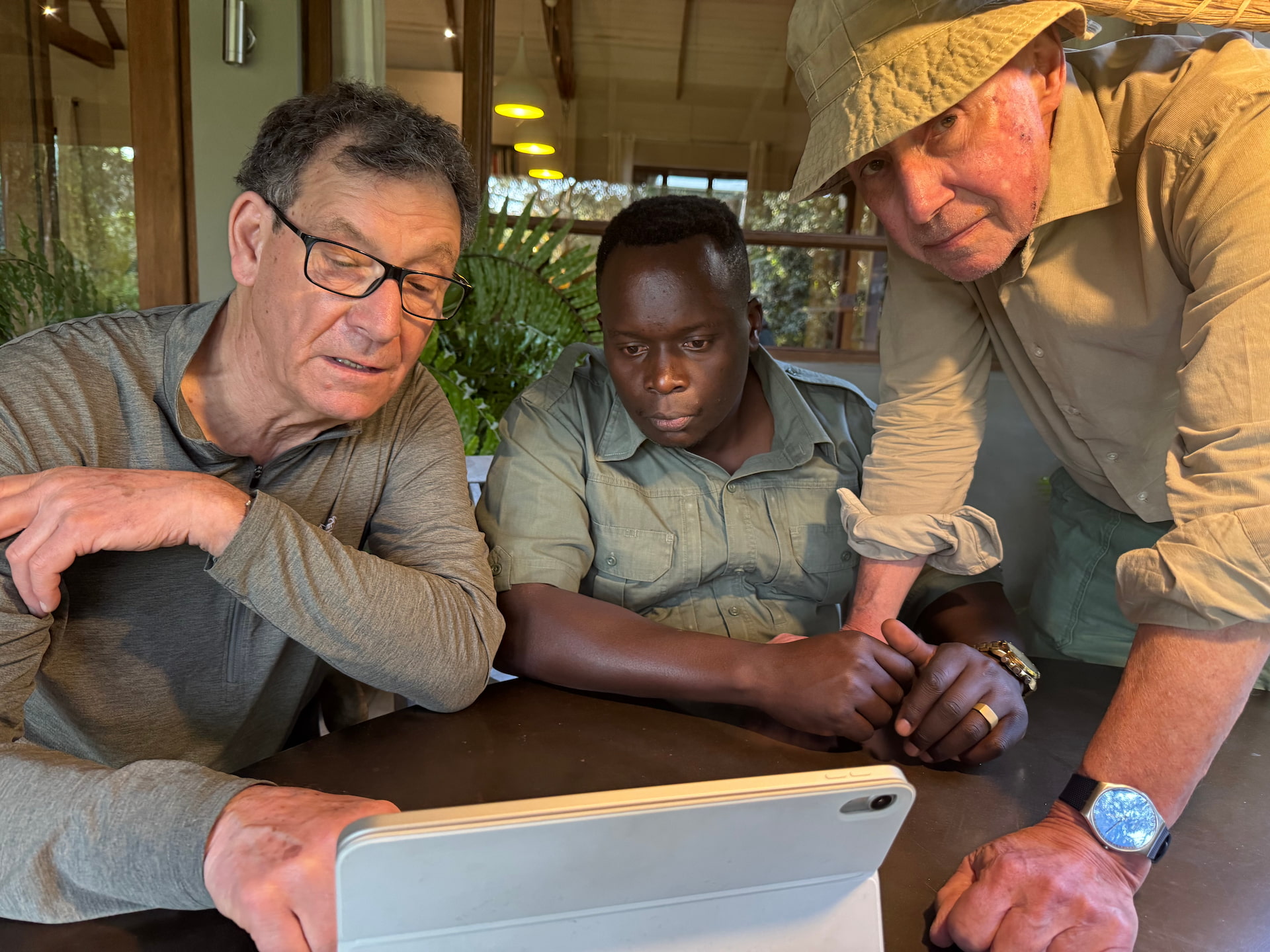 Peter, Geoffrey and Sandy, studying the routing out of Nairobi before the journey began