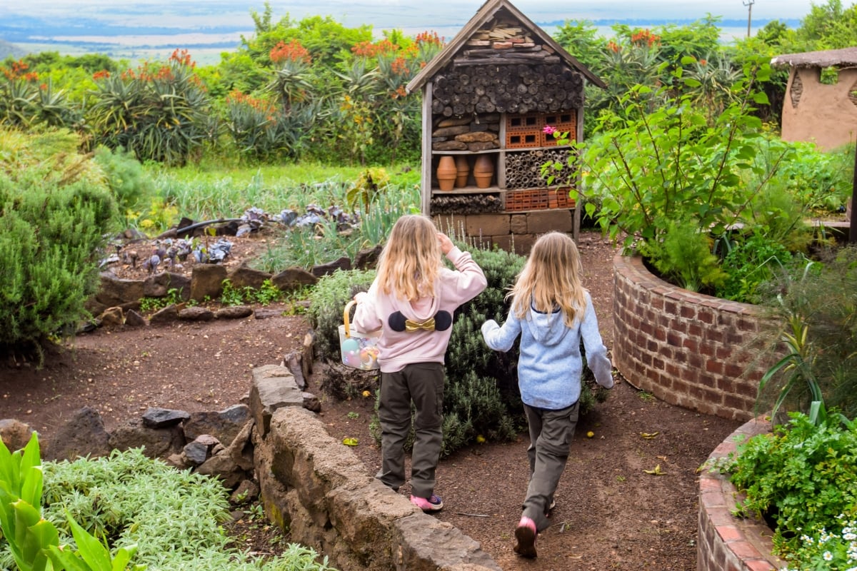 Children running around in the Shamba for an Easter Egg Hunt