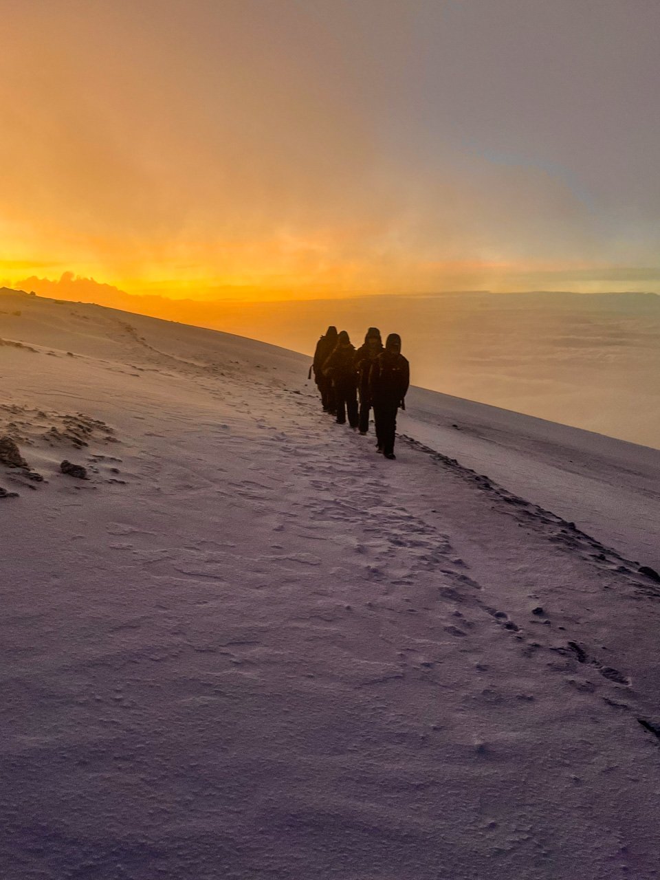 Our group making fresh tracks in the snow on the roof of Africa 