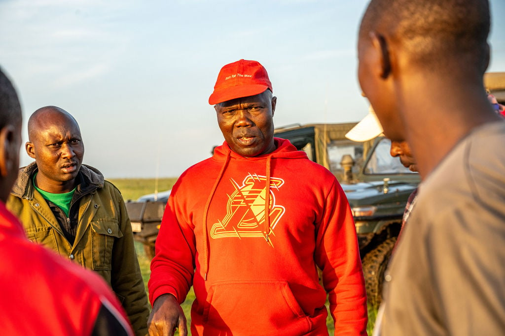 John Wayongo, Angama's Head of Security and ARC coach, gives a pep-talk to his runners 