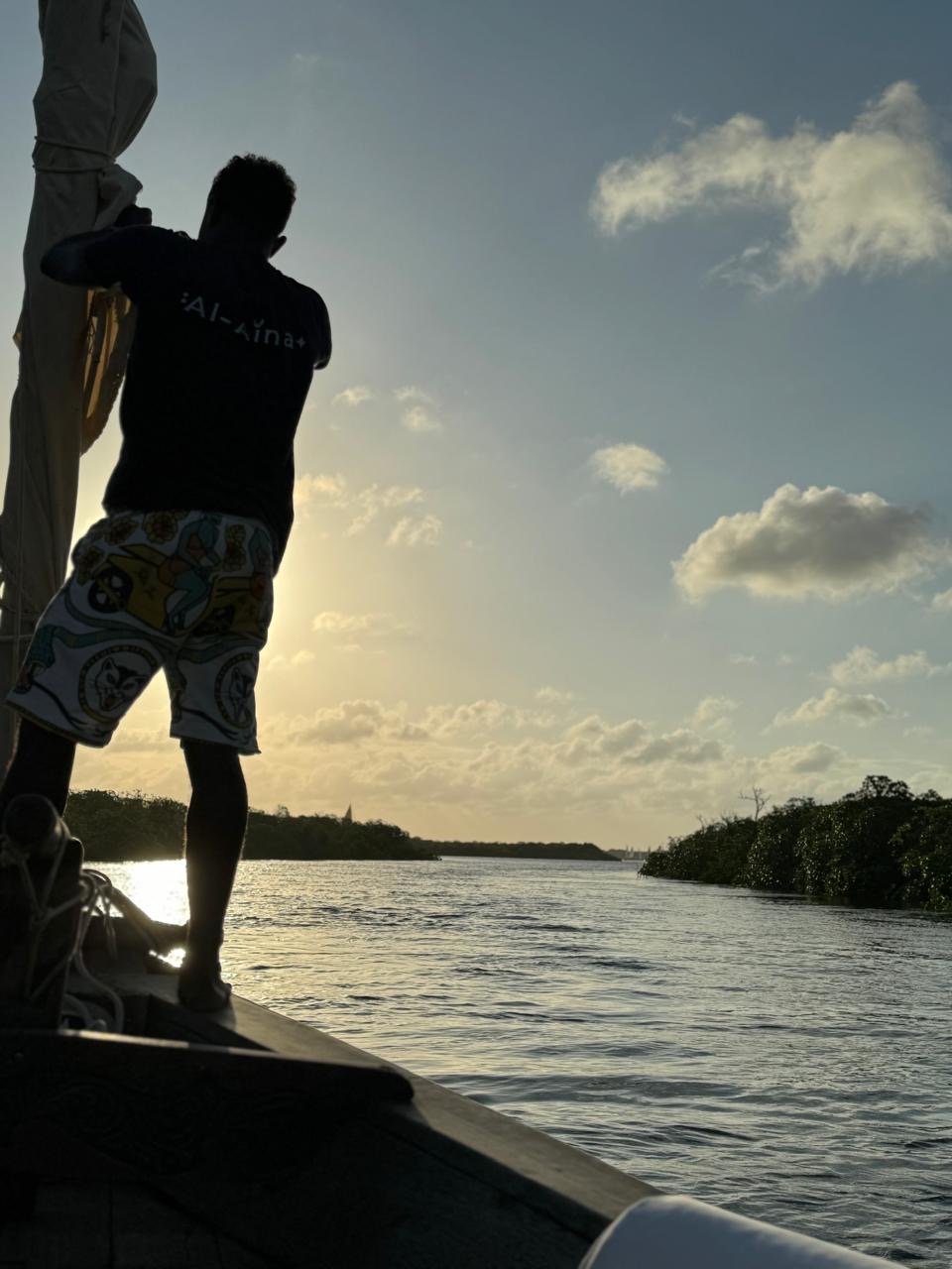 Captain Smiley guides the dhow towards Manda