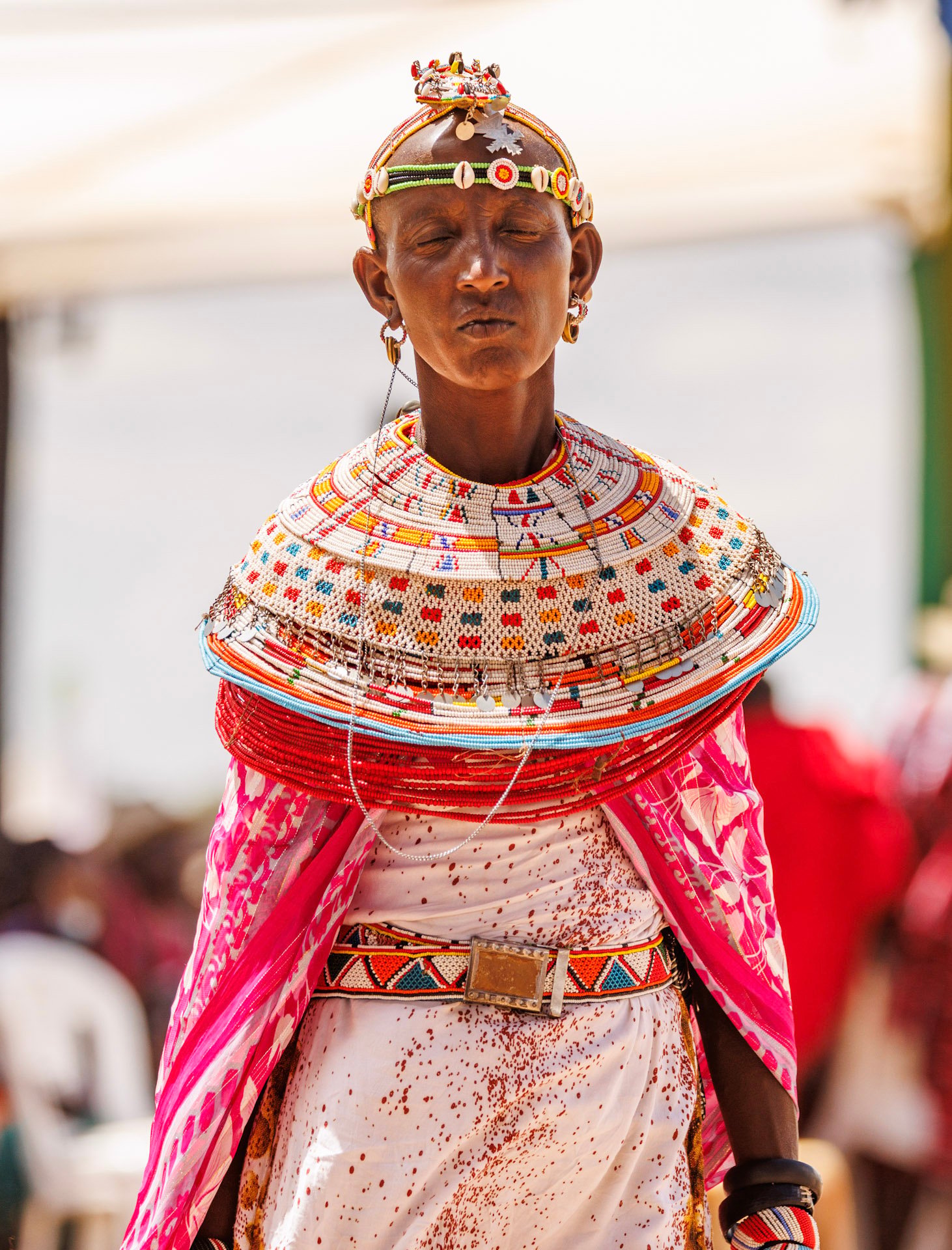Maasai beadwork colours symbolise strength (red), peace (white), life and land (blue/green), and prosperity (orange/yellow)