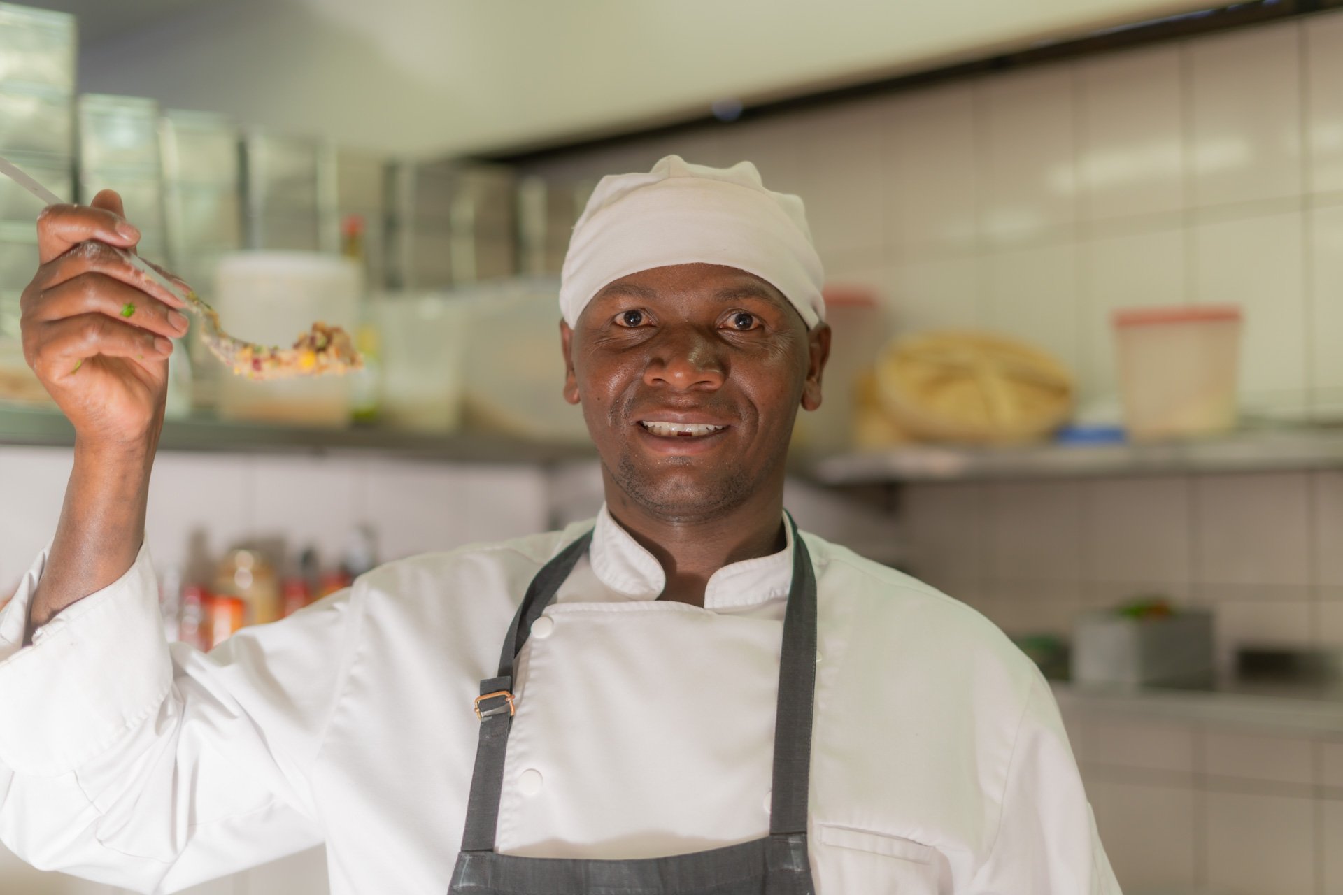 Daniel proudly displays his homemade githeri
