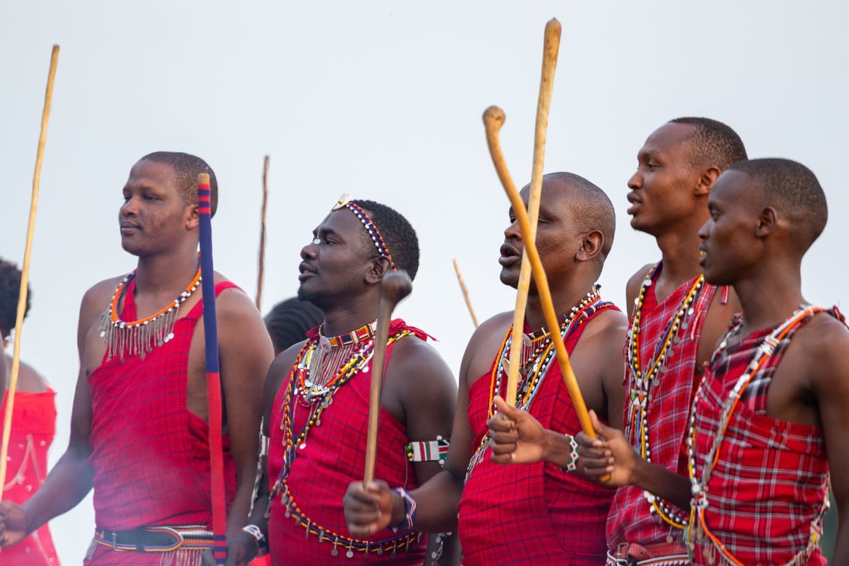 Footsteps and voices carry the beat as the Maasai lead the night