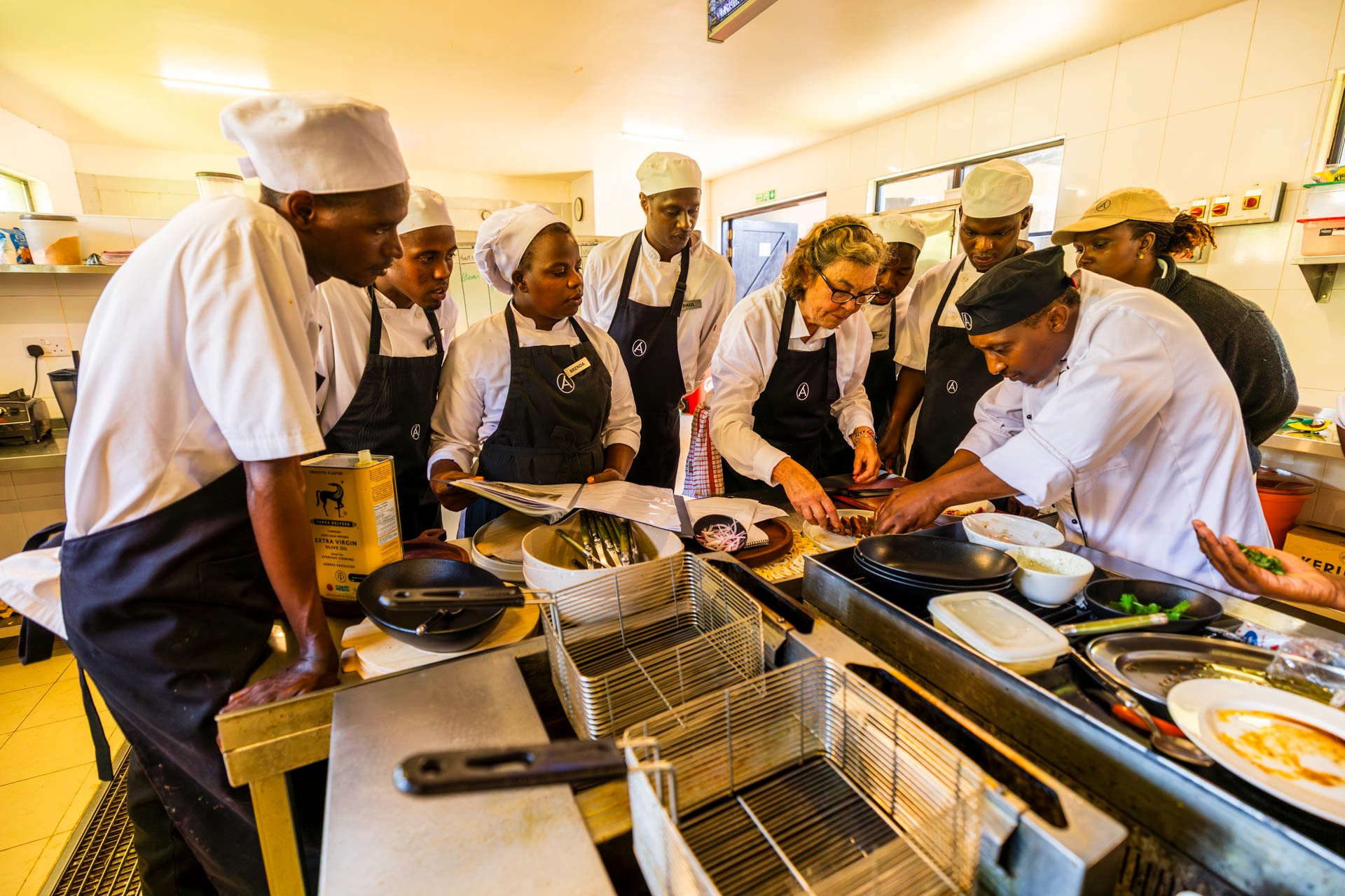 Amboseli Guide, Alice, sneaks a peek as the whole team learn the perfect plate