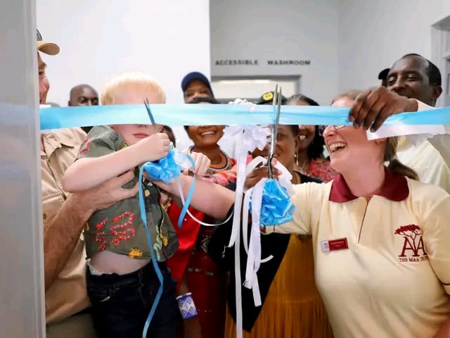 Memebers of the The Maa Trust and Maasai community cut the ribbon