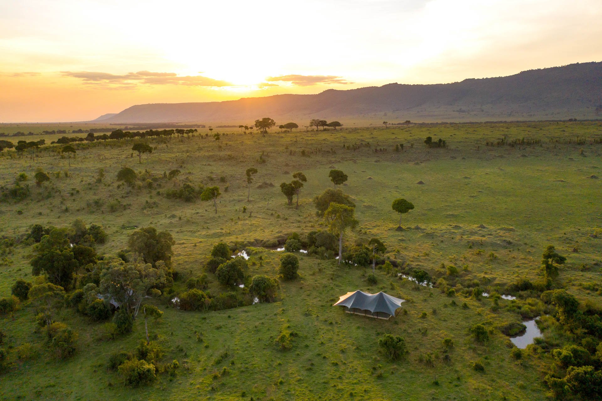 Angama Safari Camp is a mobile tented camp that moves across the Mara