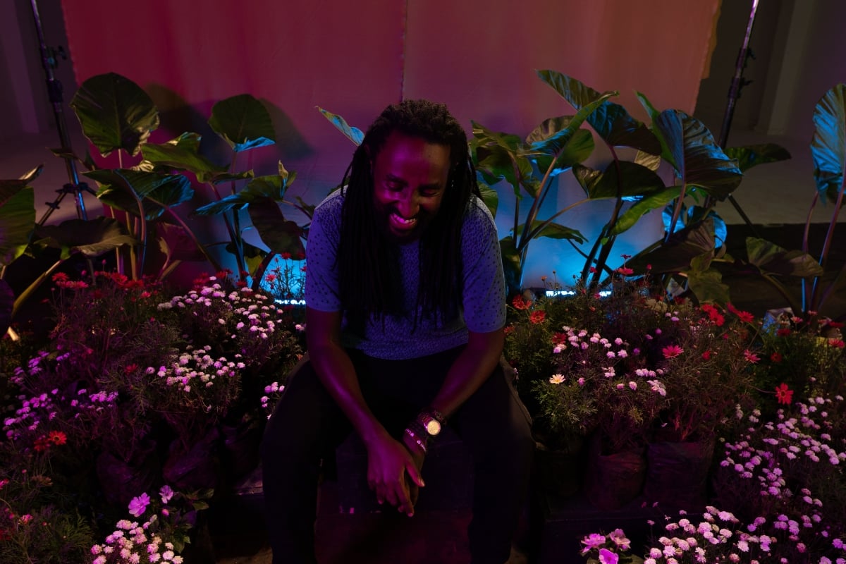 Studio setup in Nairobi with 100+ live plants and layered lighting to create a dreamlike scene