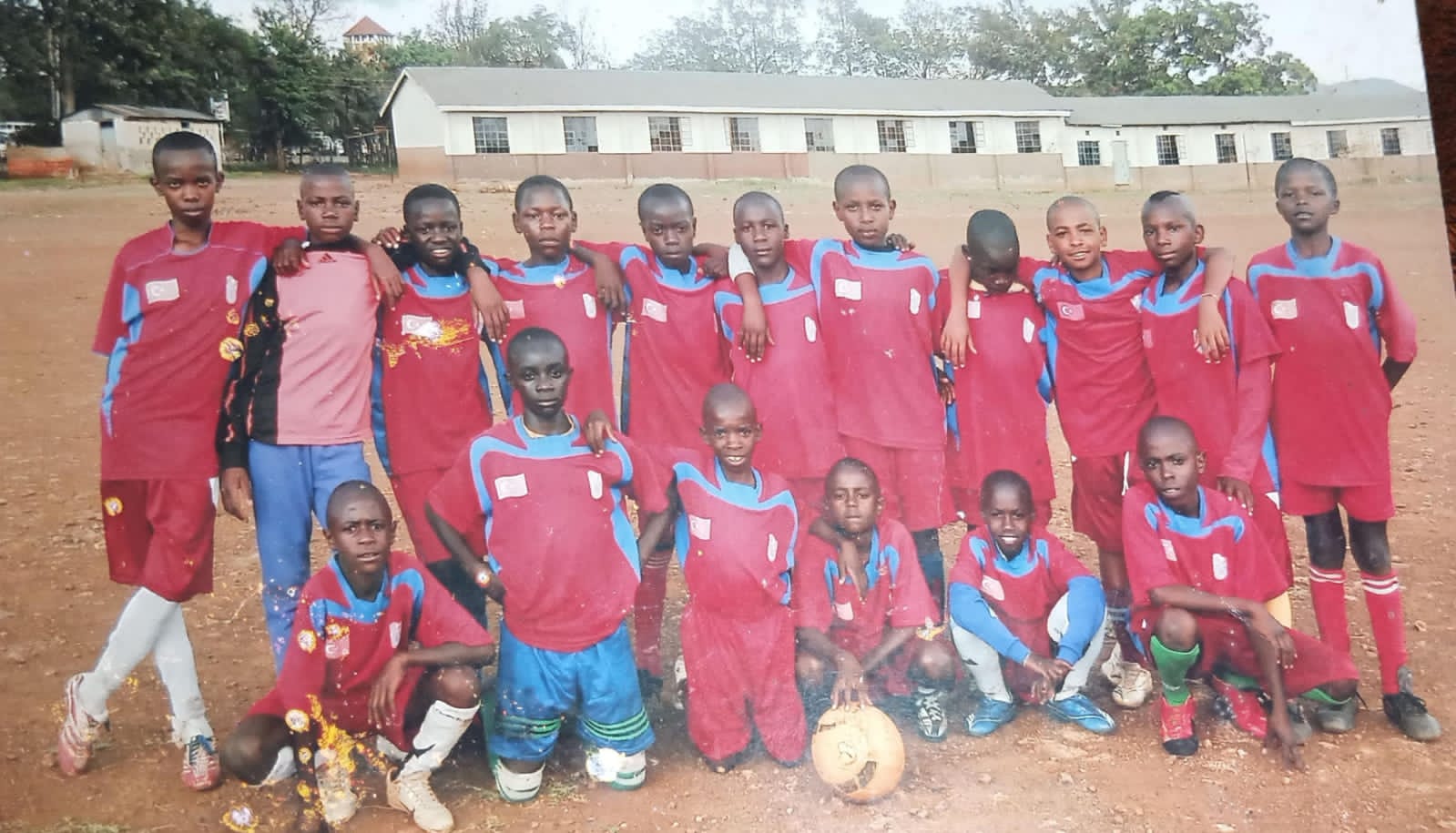 Joseph (third from the right, top row) and his team mates before a match 