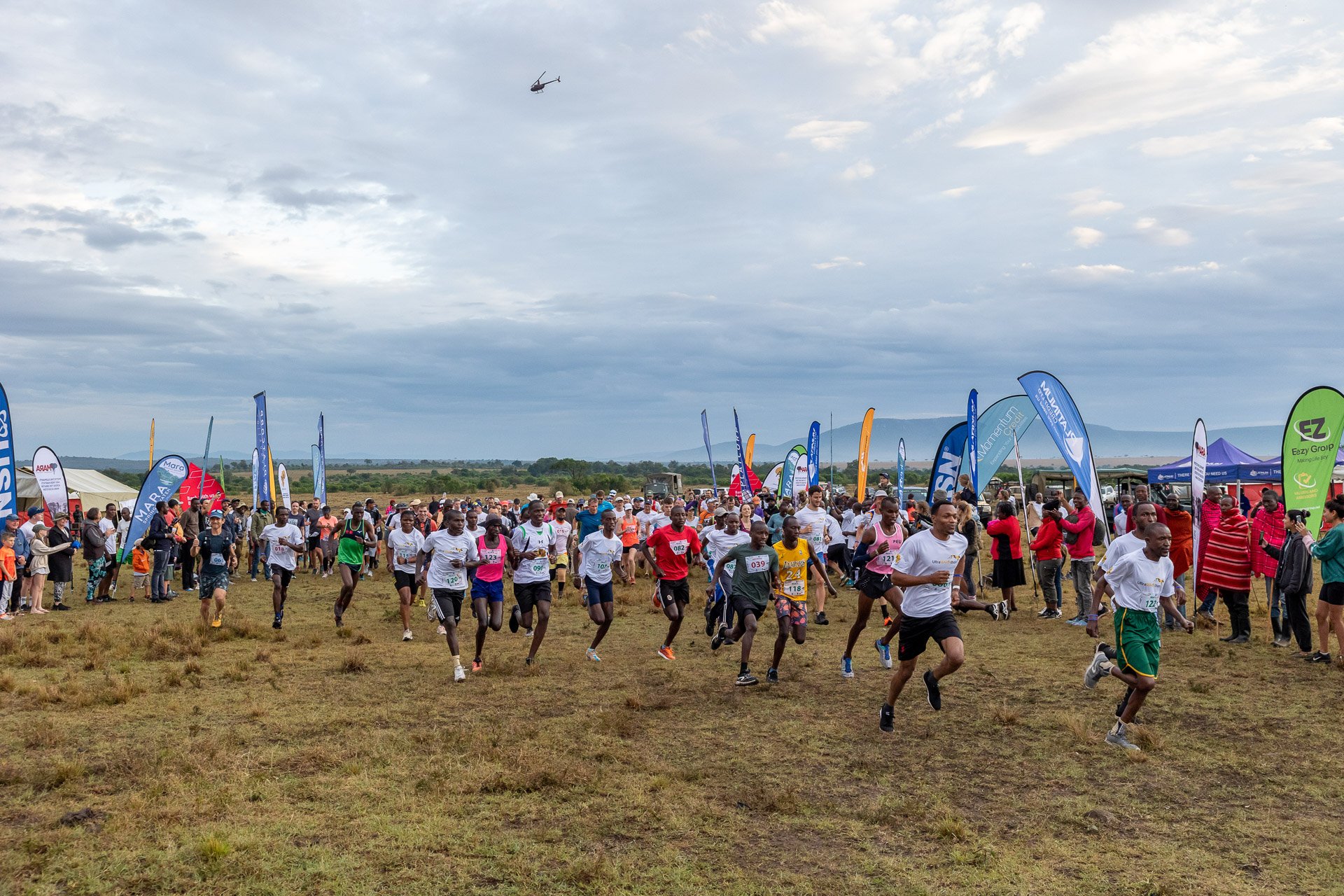 Runners from all over the world surge forward, with ten countries represented