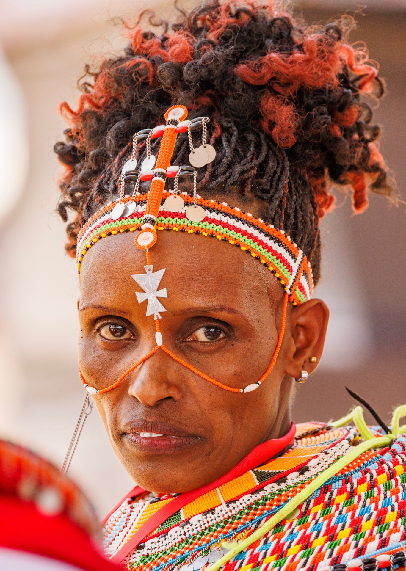 While materials have evolved, the geometric patterns and symbolic colours remain a vital link to ancestral roots