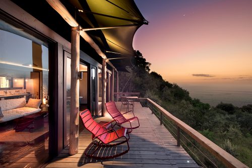 Angama's iconic red rocking chairs sit handsomely overlooking the Mara