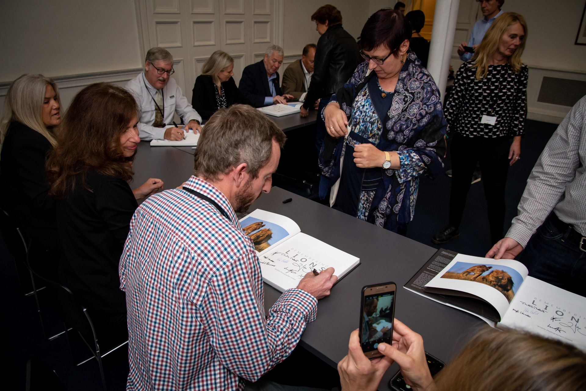 Adam Bannister, signing books 