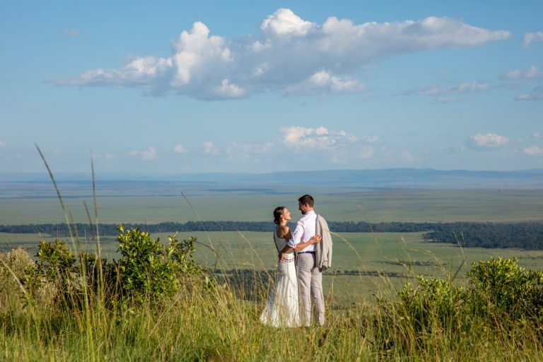 Bride and groom with Mara view