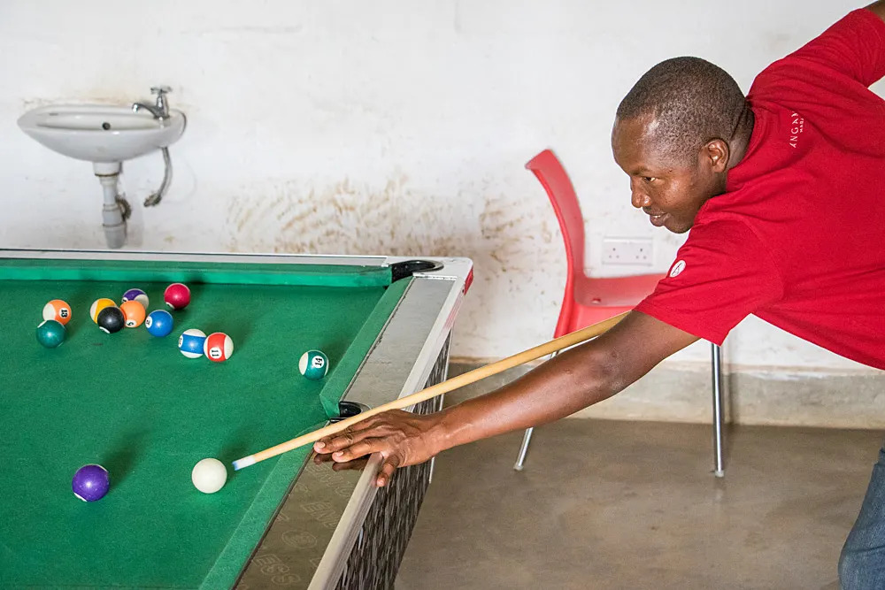 Playing pool to relax from the day