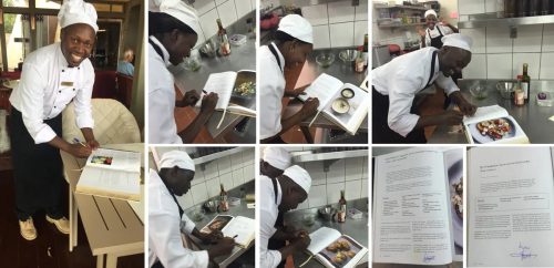 Angama chefs signing the page of their chosen recipe