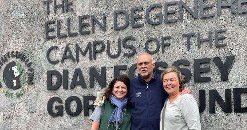 Dr Tara Stoinski, Praveen Moman and Nicky stand outside the Campus