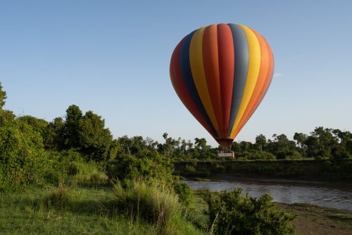 Above: A hot-air balloon glides gently over the full Mara River 