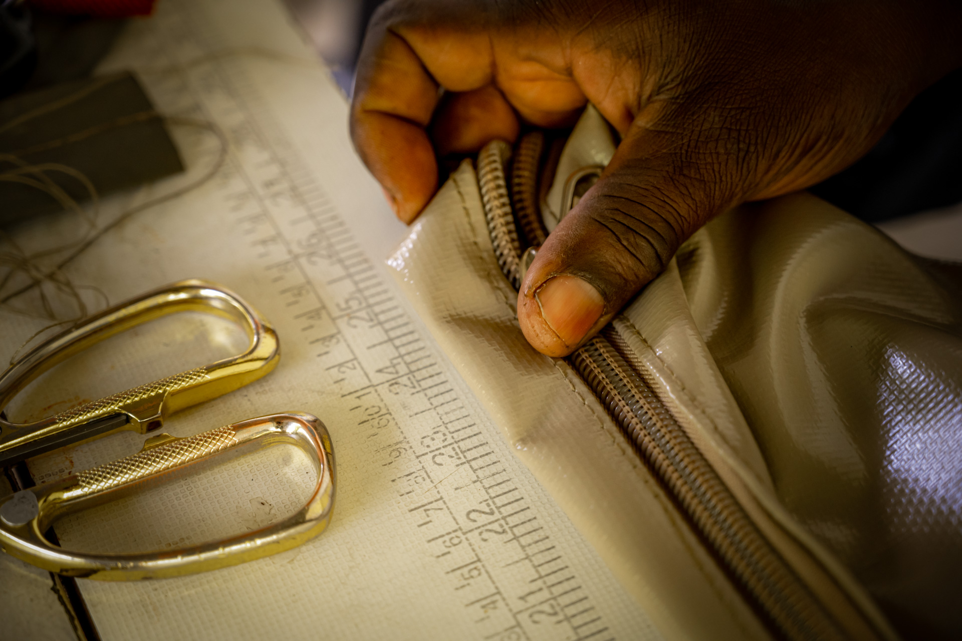 Measuring out a butler's bag which Ondeyo designed and makes