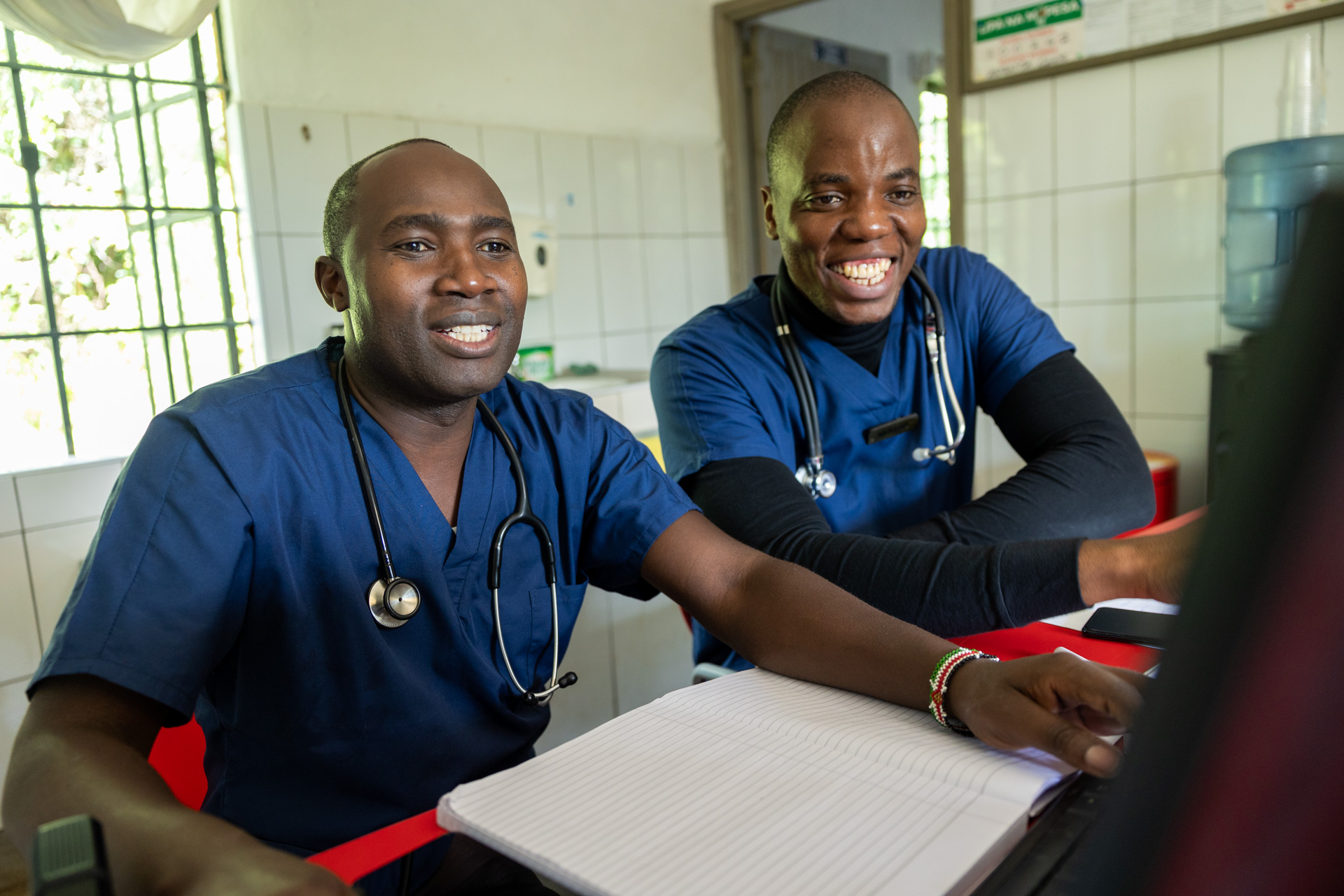 Not even the paperwork can dampen Dr Emmanuel and Dr Mark's smile  