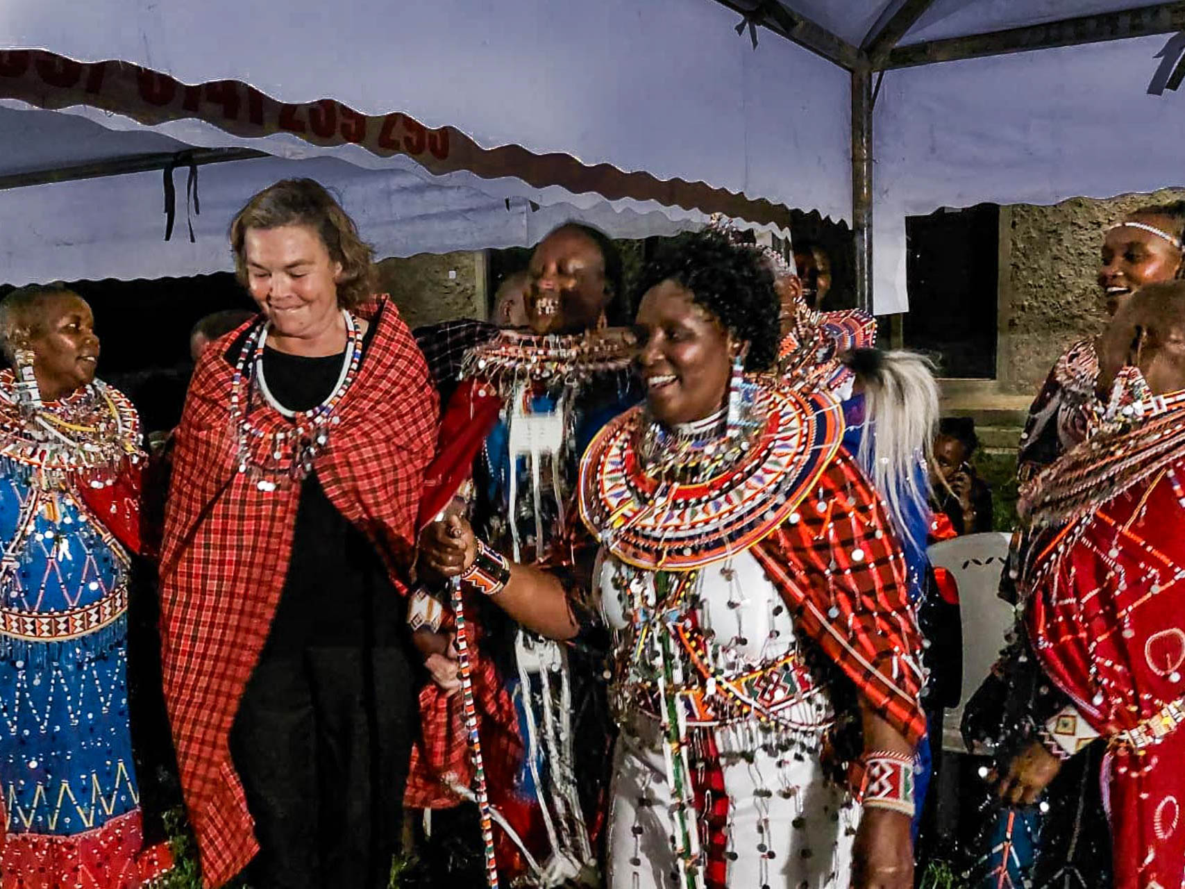 Mama Nicky dances with the beautiful women of Amboseli