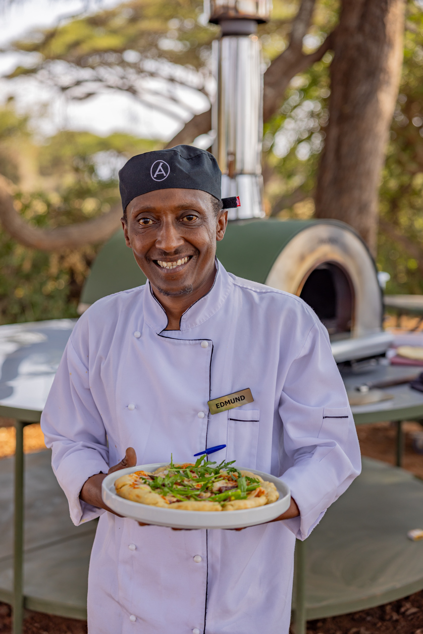 Chef Edmund putting the new pizza oven to the test at Angama Amboseli