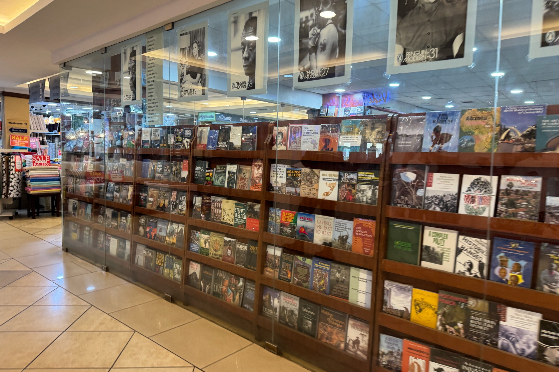 Literature looks down from the top shelf. History fills everything beneath it